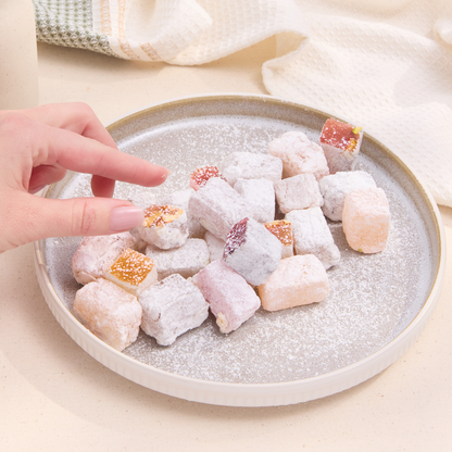 Berry Delights candy served in hand – soft fruit and nut confection with berries and walnuts